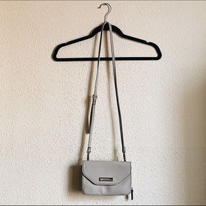 Over the shoulder purse with detachable wallet.